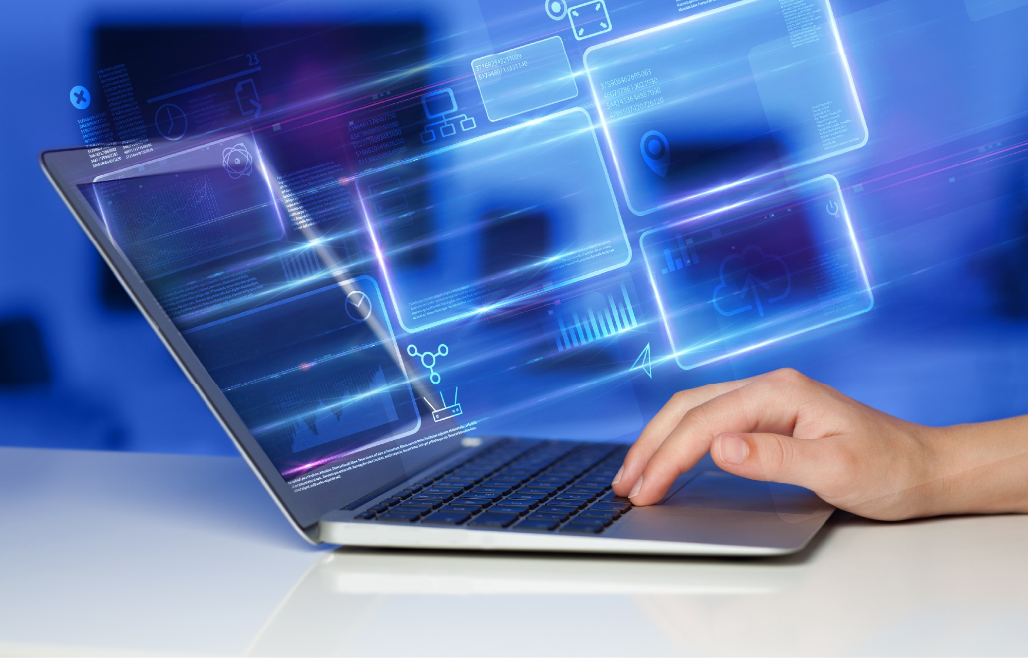 Conceptual image of a hand typing on a laptop against a blue and purple background with the outline of computer screens representing how to create an ATS resume