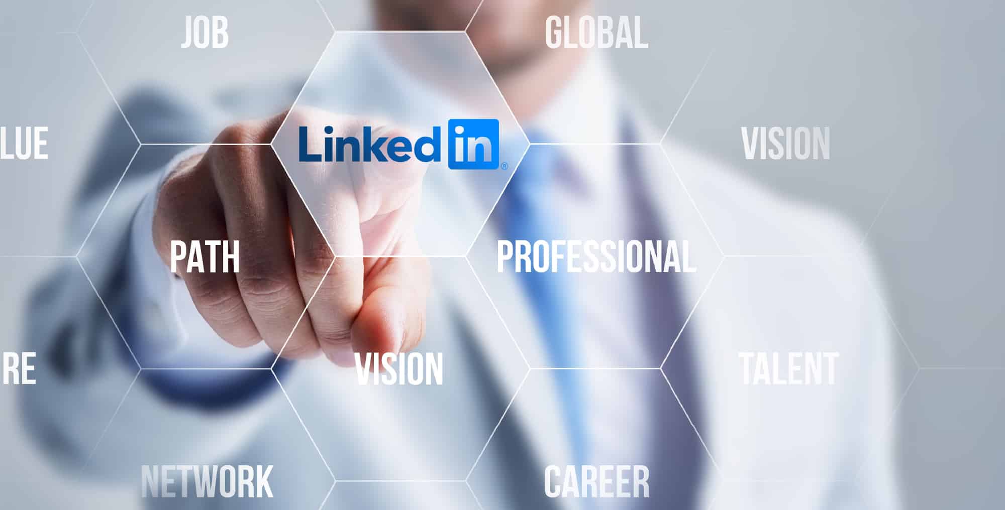 Man in suit touching the words LinkedIn - representing the concept of LinkedIn Profile Tips for Job Seekers